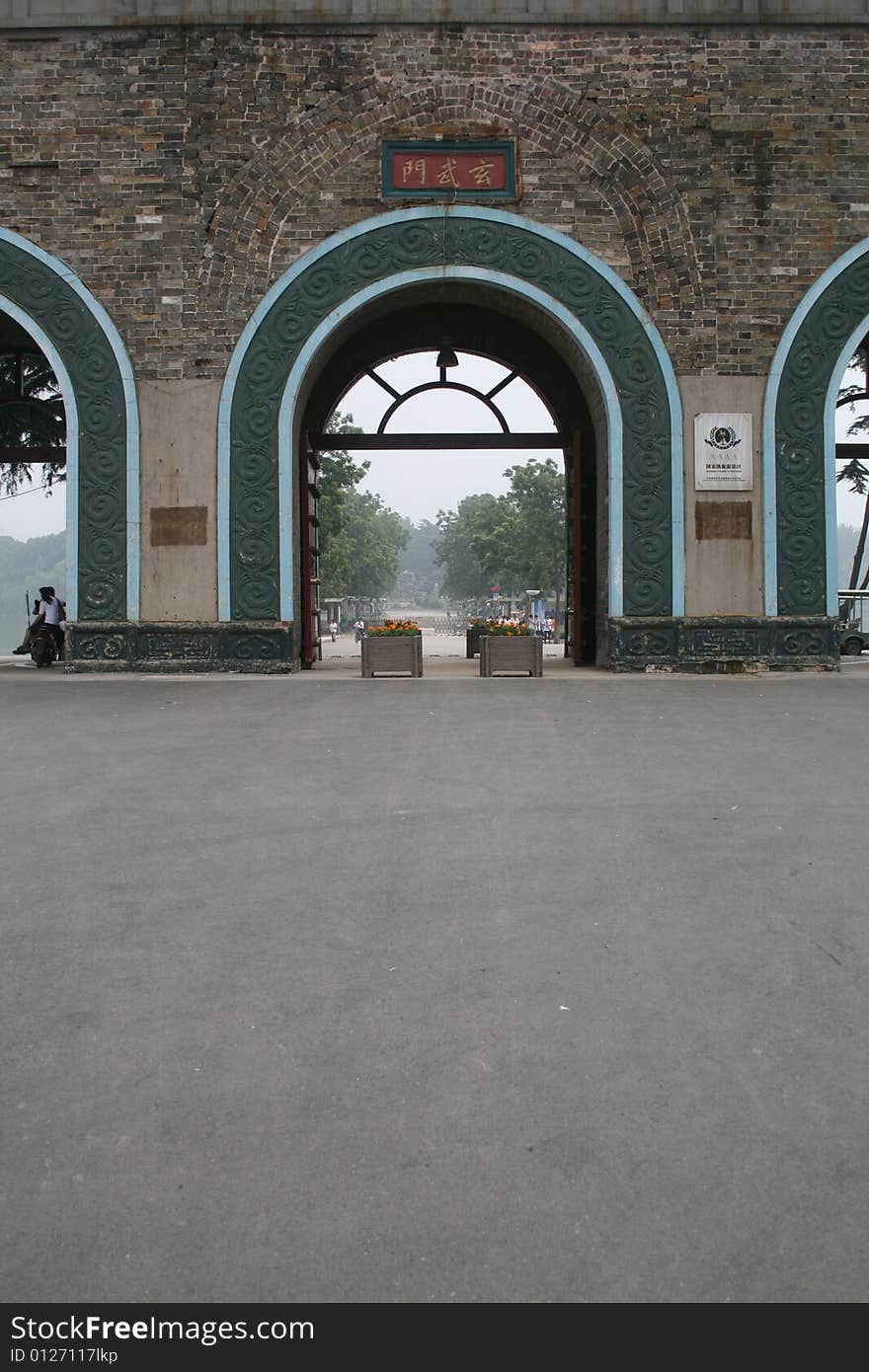 The building is the famous gate which named xuanwu gate in nanking .It is a very old building . The building is the famous gate which named xuanwu gate in nanking .It is a very old building .