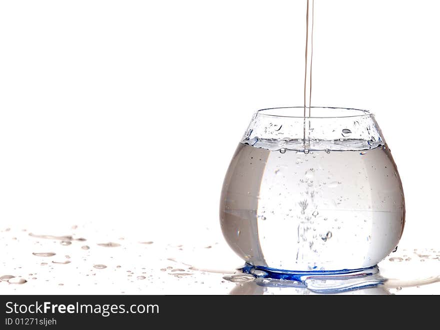 Blue glass of water isolated by white background