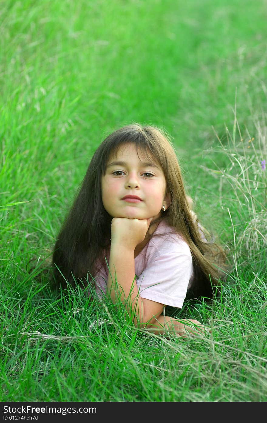 A shot of little girl on grass