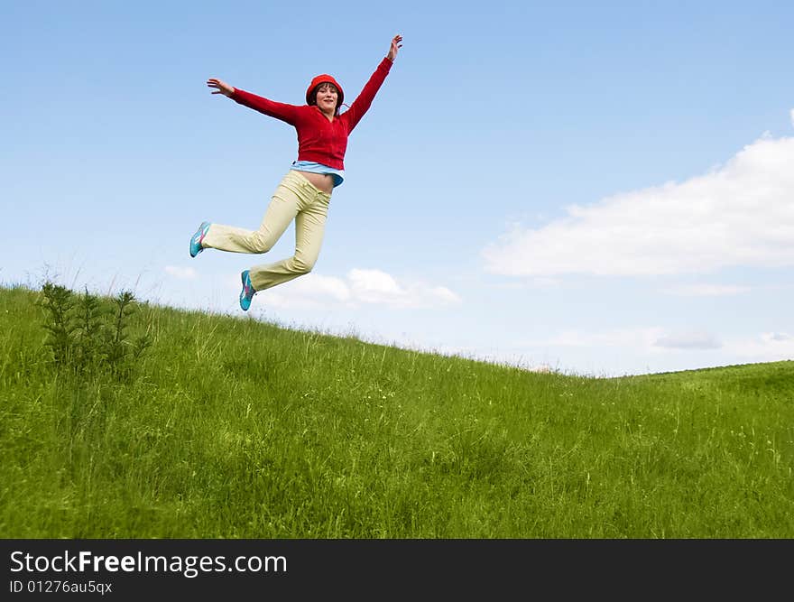 Happy free girl jumping on the hill. Happy free girl jumping on the hill