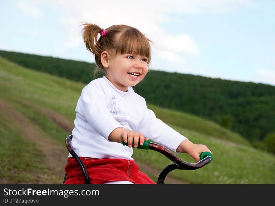 Girl Riding A Bicycle