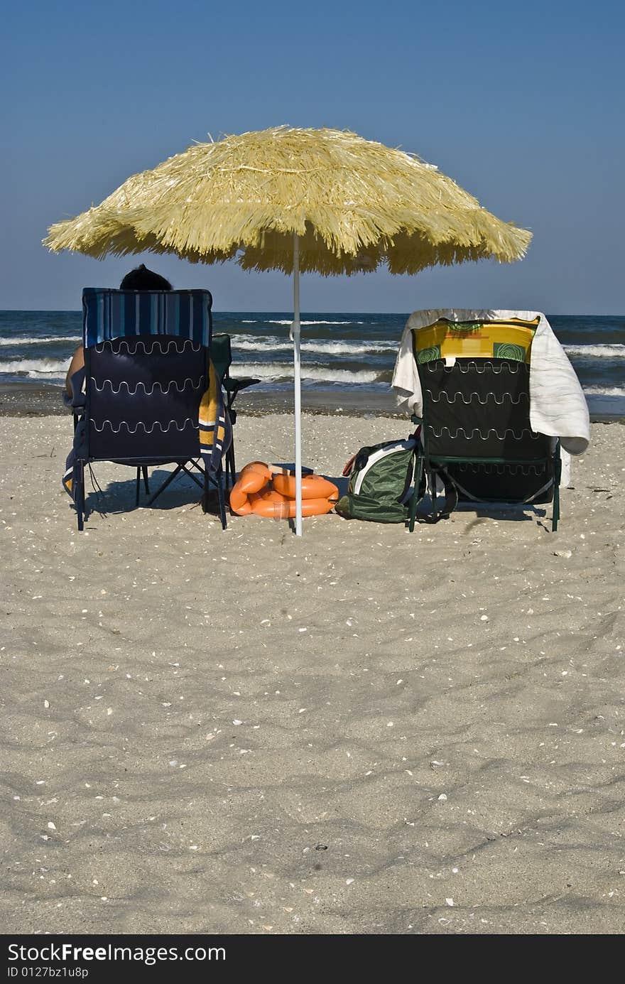 Yellow reed umbrella on Black Sea beach. Yellow reed umbrella on Black Sea beach