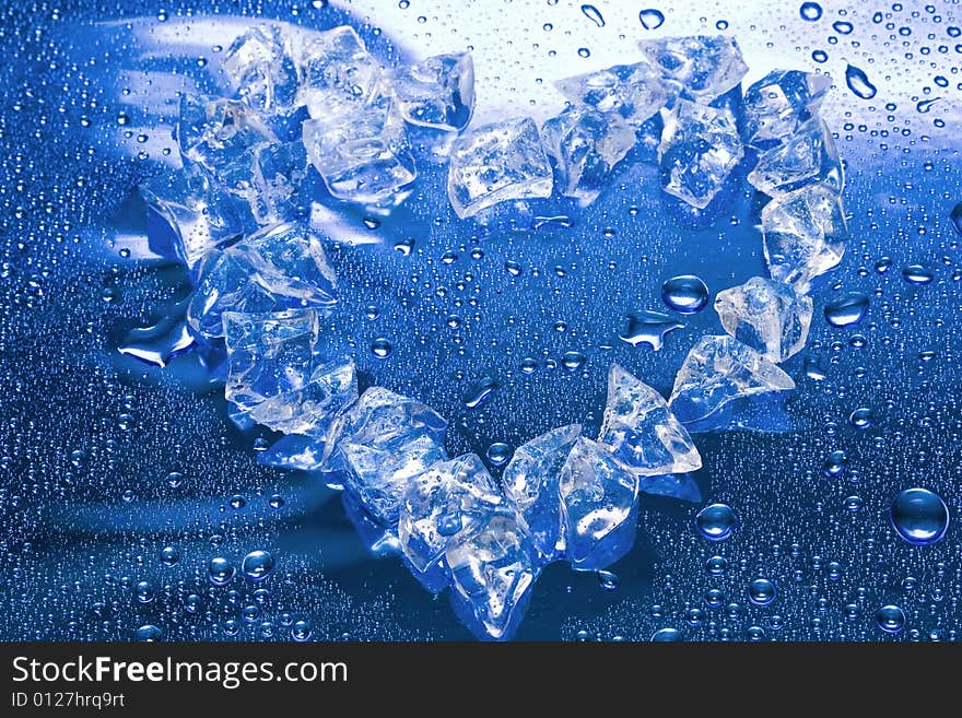 Heart from ice on blue background