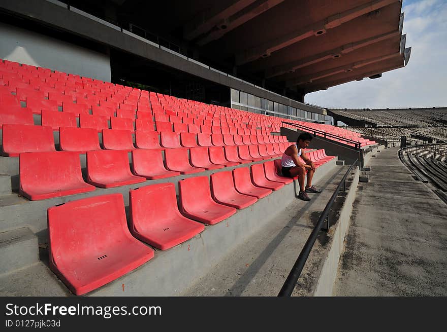 Picture of an athlete looking into empty space. Useful for describing loneliness, failure, rejection, etc. Picture of an athlete looking into empty space. Useful for describing loneliness, failure, rejection, etc.