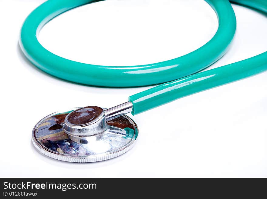 Green stethoscope on a white background