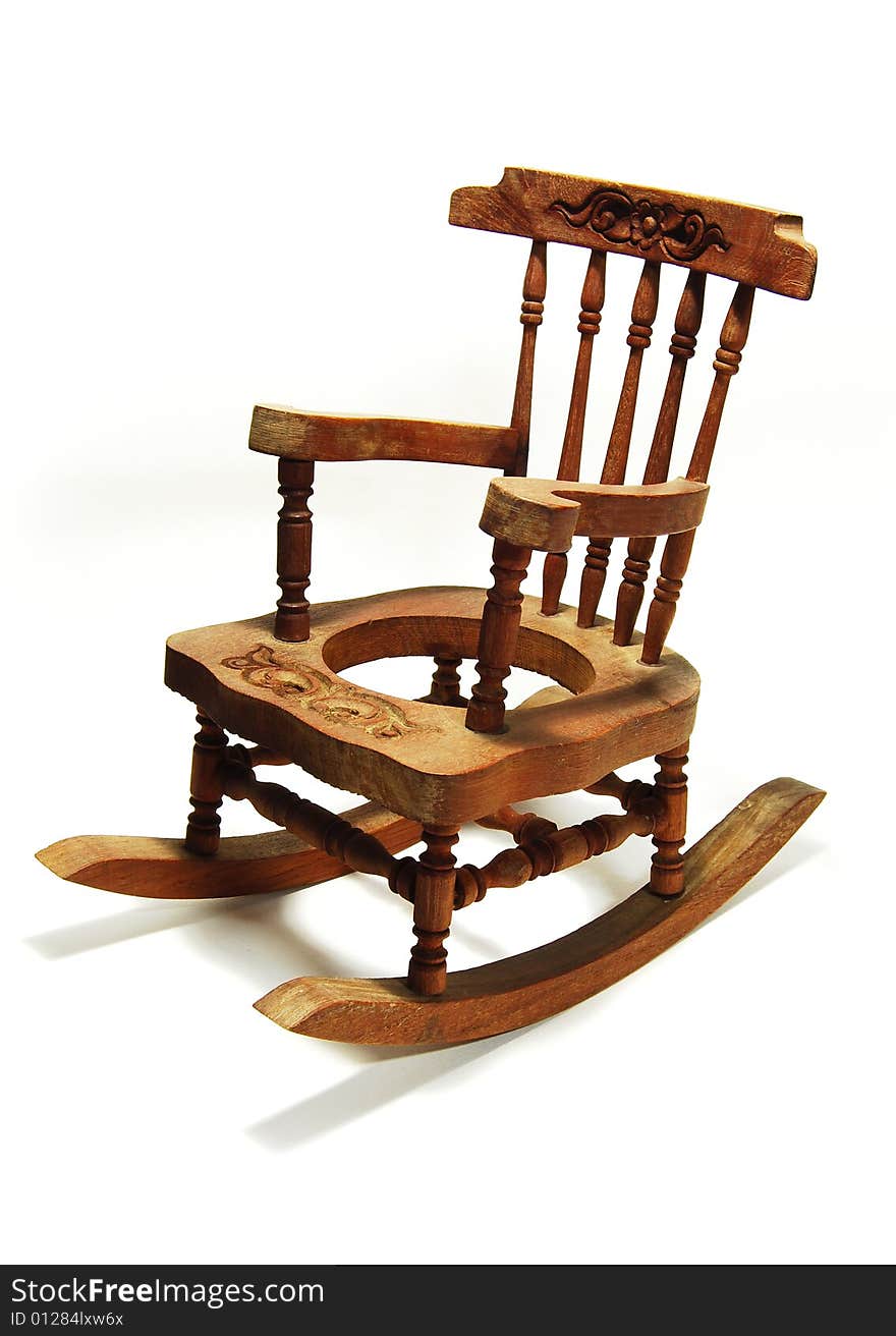 A miniature rocking chair contrasting with a clean white background