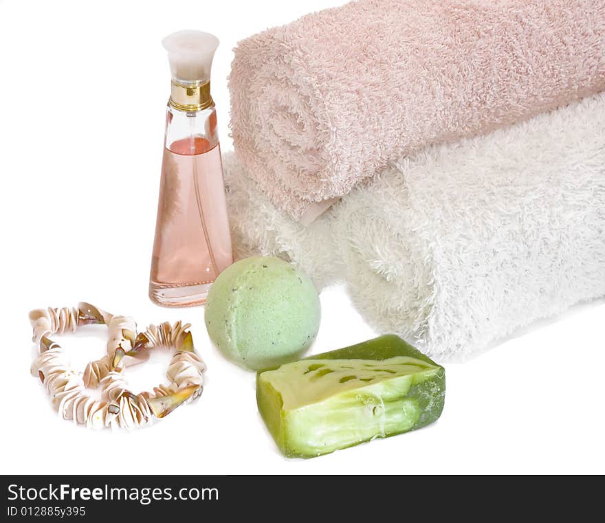 Spa aromatherapy and towels on white background