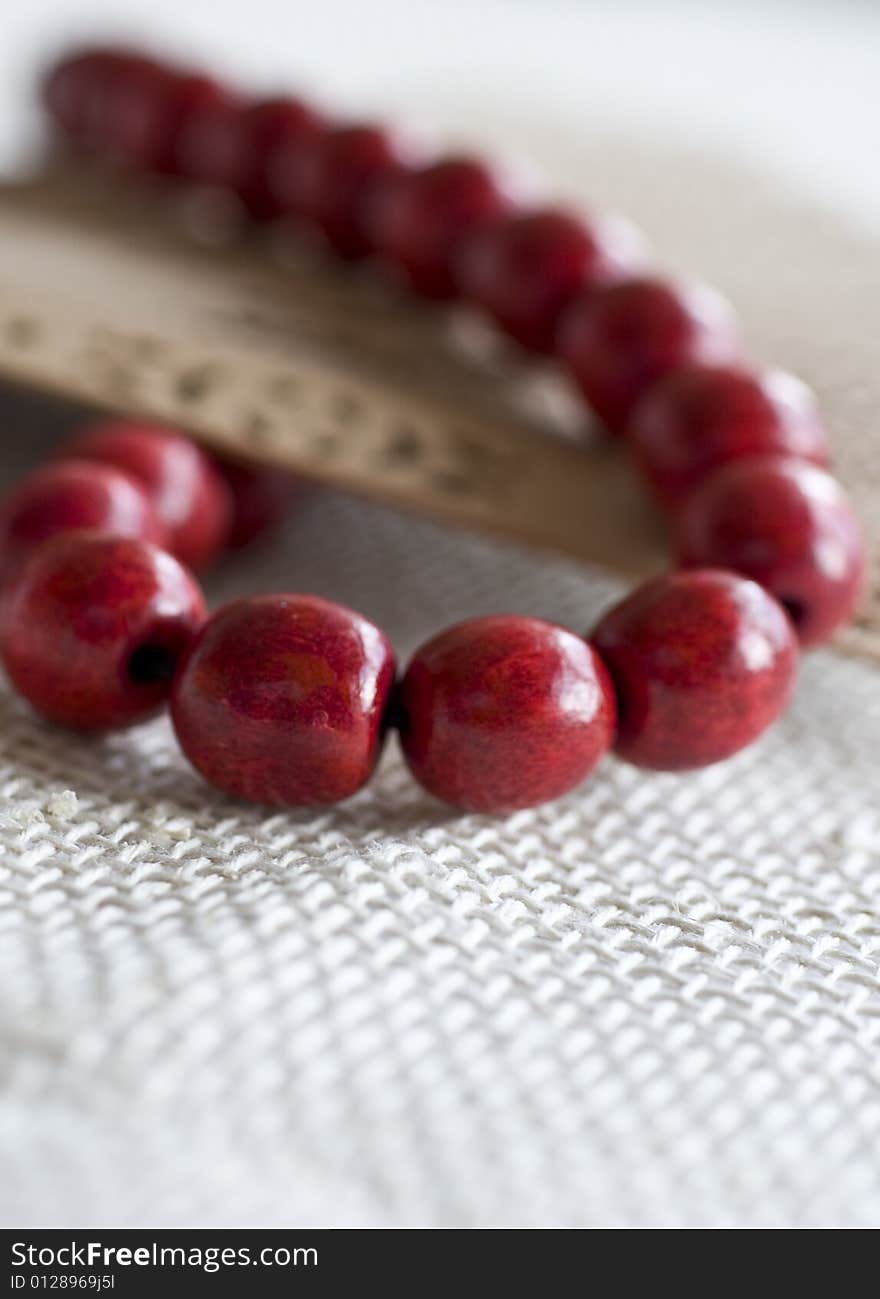 Red wooden beads with a fan. Red wooden beads with a fan