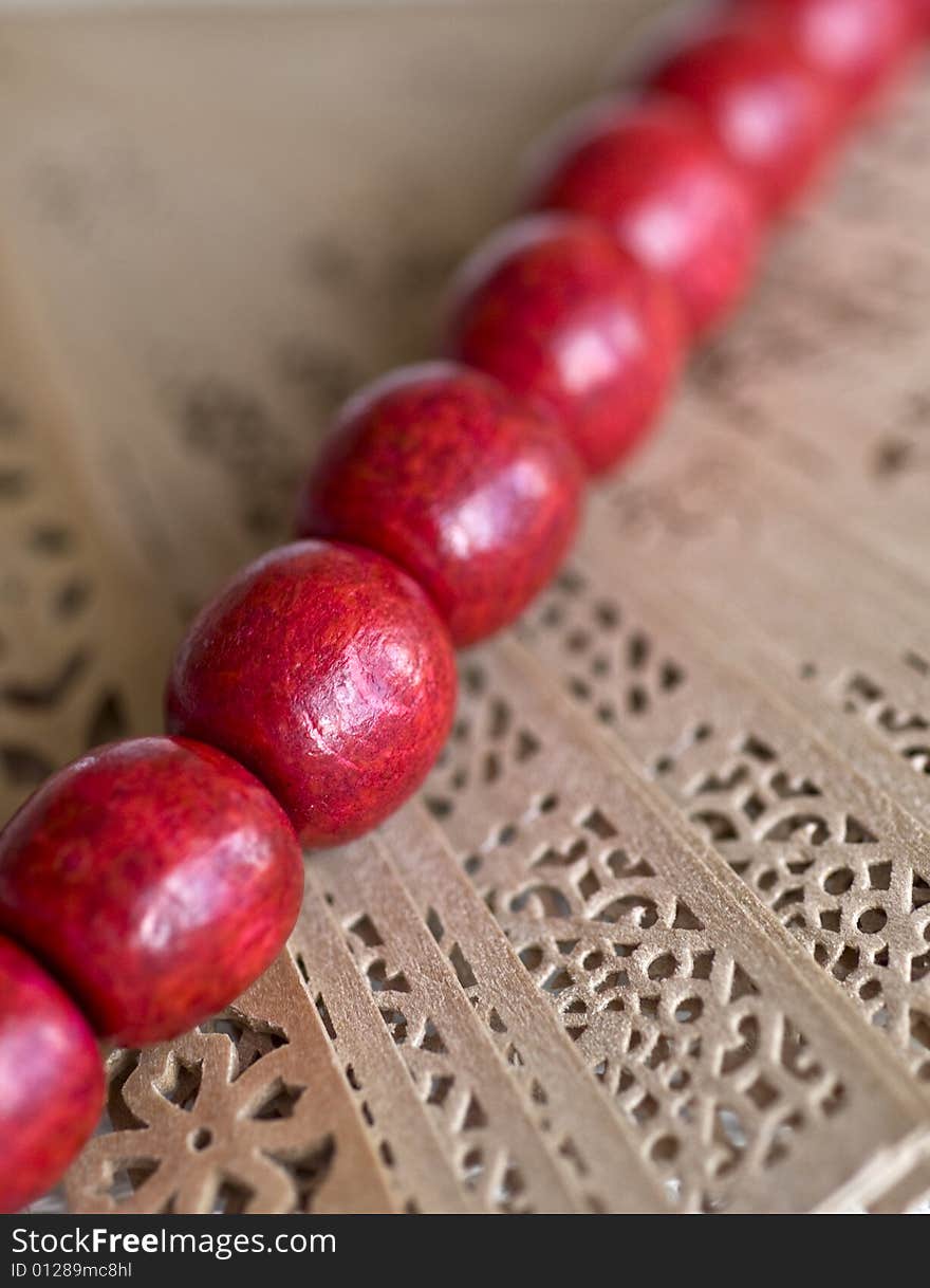 Red wooden beads with a fan. Red wooden beads with a fan