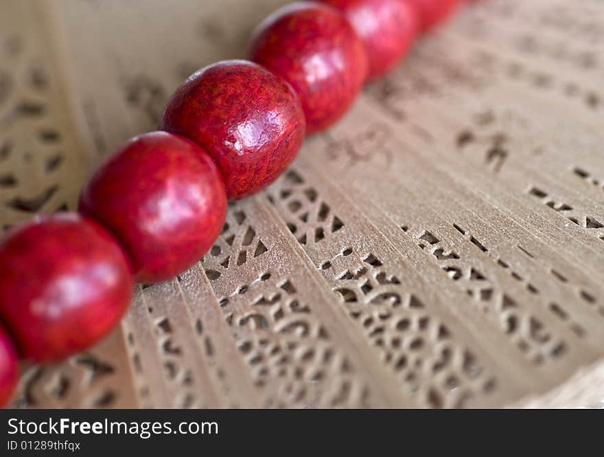 Red wooden beads with a fan. Red wooden beads with a fan