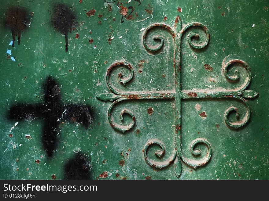 Old metal green door with cross. Old metal green door with cross