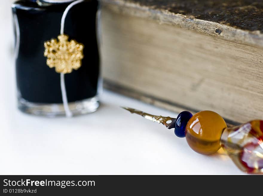 Ancient book with a feather and jar blackened on a white background. Ancient book with a feather and jar blackened on a white background