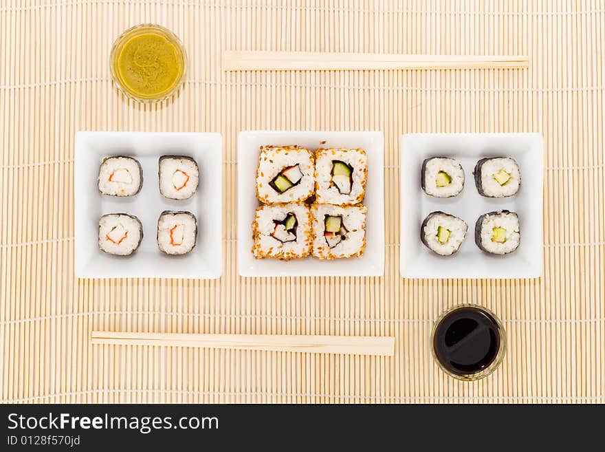 Three plates with different kinds of sushi