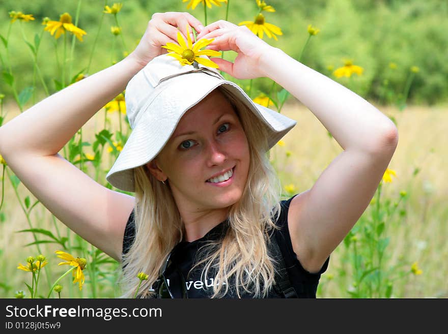 The photograph of the girl abloom of field. The photograph of the girl abloom of field