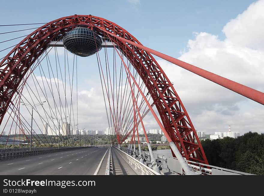 Modern bridge on cloudy background