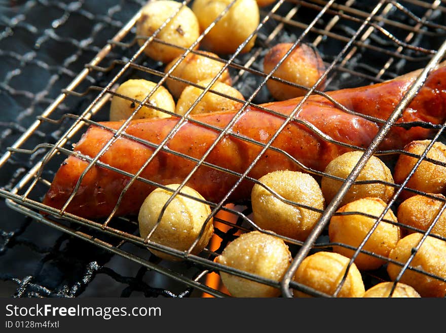 Grill with potatoes and sausage