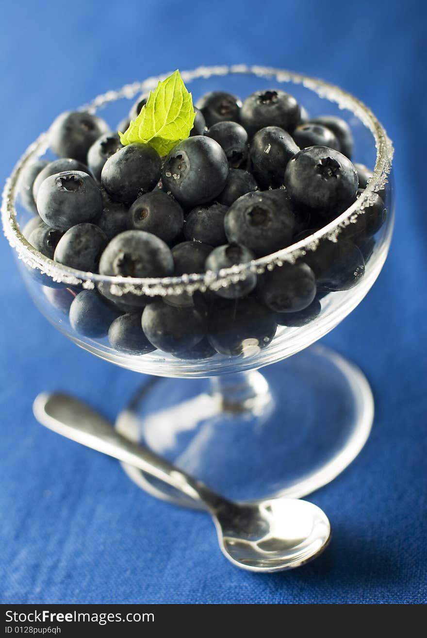 Fresh blue berries in glass close up. Fresh blue berries in glass close up