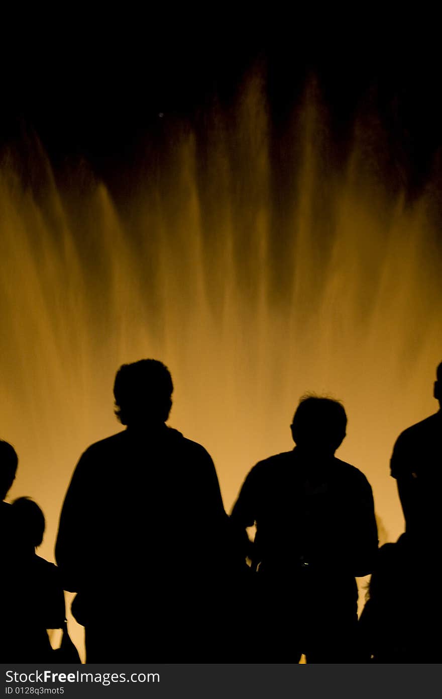 Cup of friends watching a fountain show. Cup of friends watching a fountain show