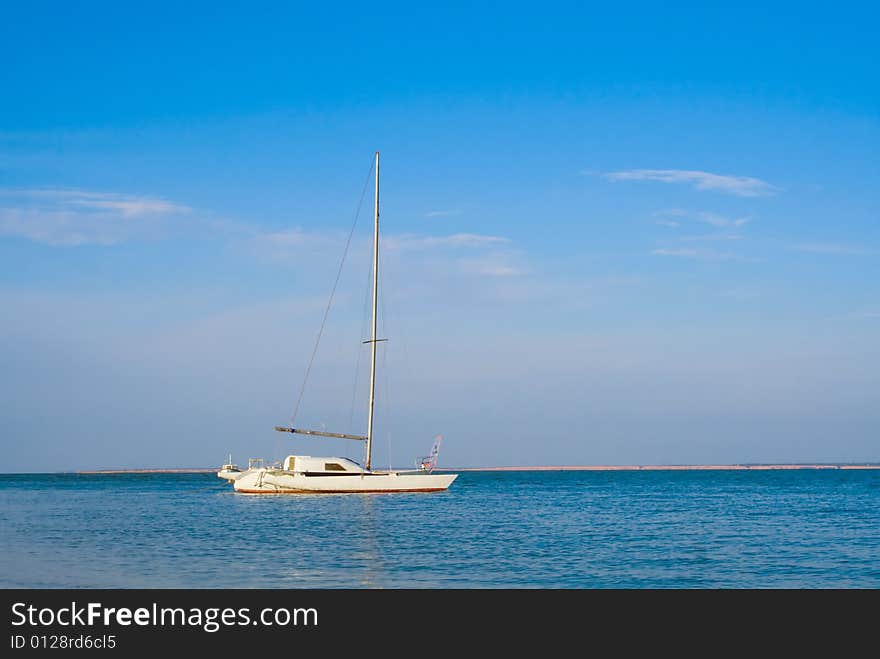 White ship, blue sea, sky and clouds. White ship, blue sea, sky and clouds