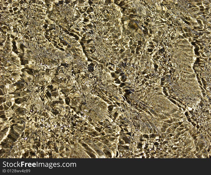 Low level water over a beach sand. Low level water over a beach sand.