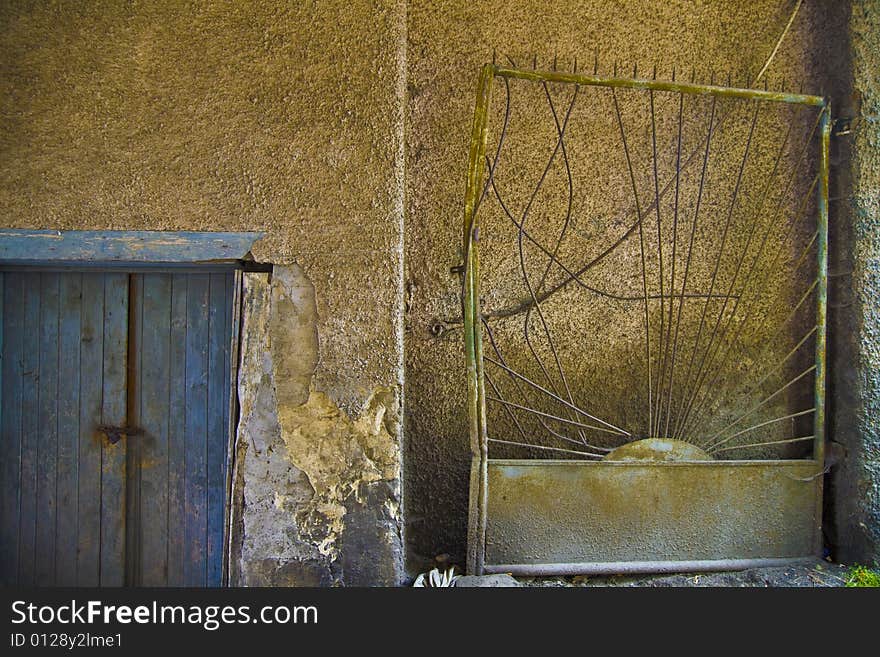 Old wall with nice colors, graphic structure, doors and gate. Old wall with nice colors, graphic structure, doors and gate