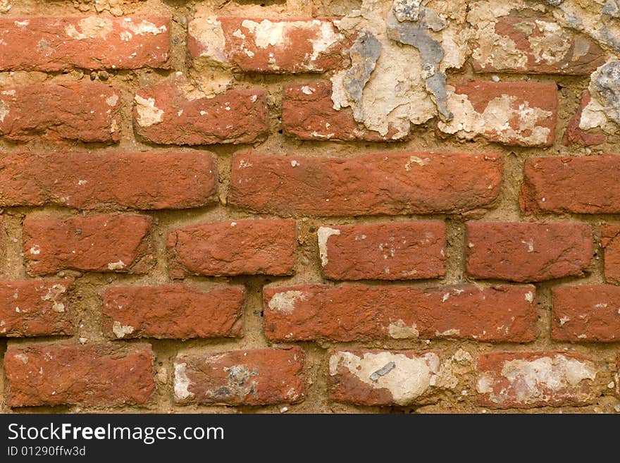 A very grungy red brick wall. A very grungy red brick wall