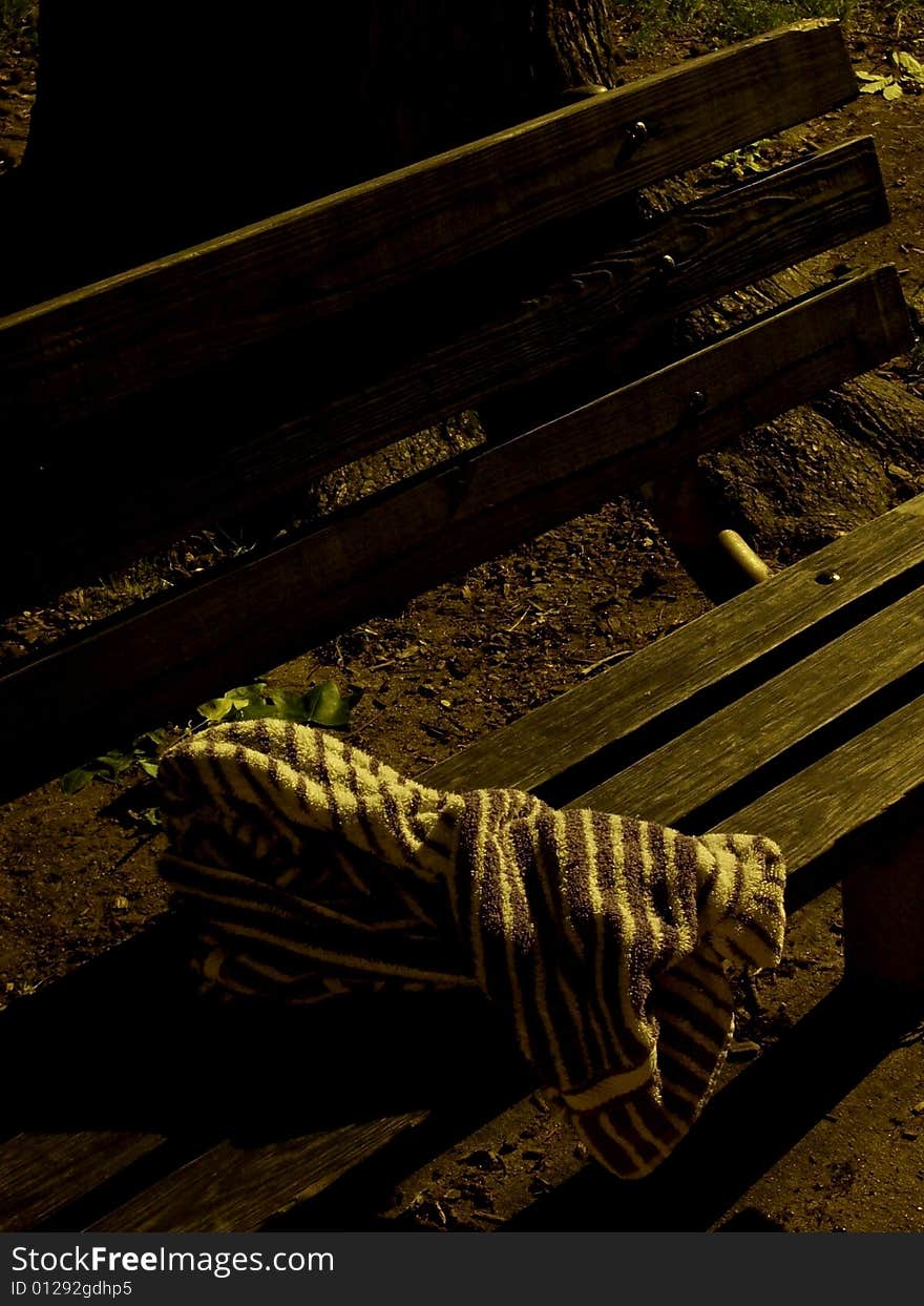 A towel sits forgotten at the park.