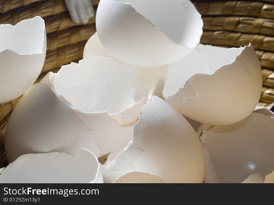 Broken eggshells in a basket