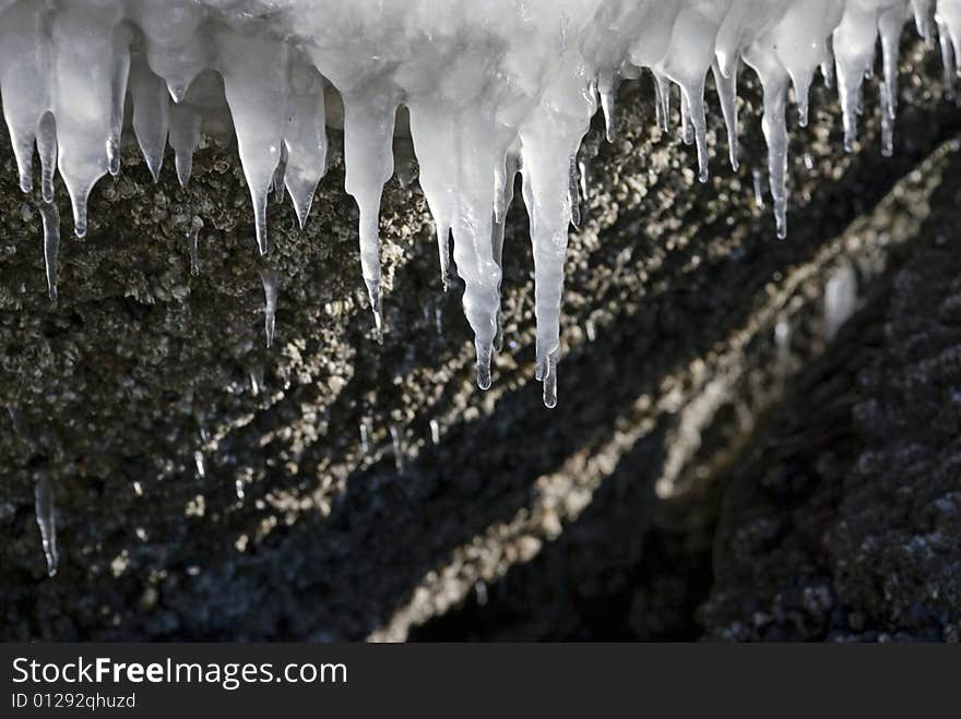 Melting icicles on stones