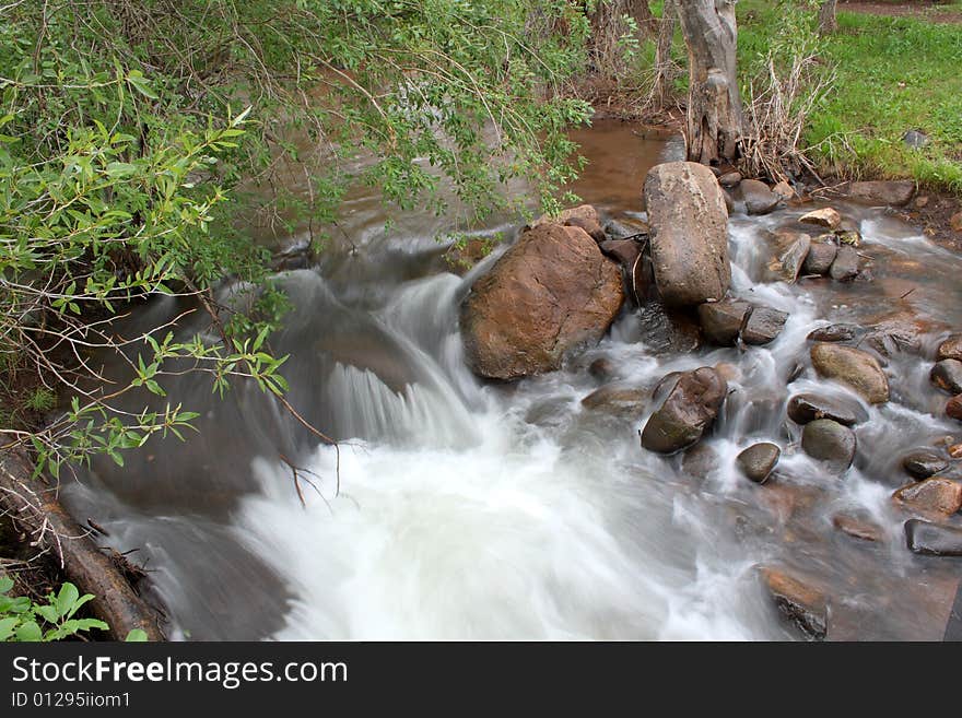 Long exposure of a gently flowing stream and these small rapids. Long exposure of a gently flowing stream and these small rapids