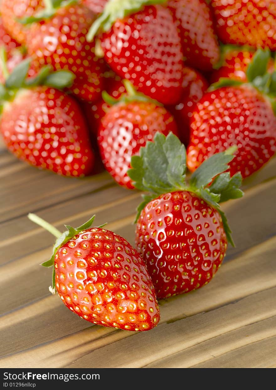 Fresh strawberries on brown wood table. Fresh strawberries on brown wood table