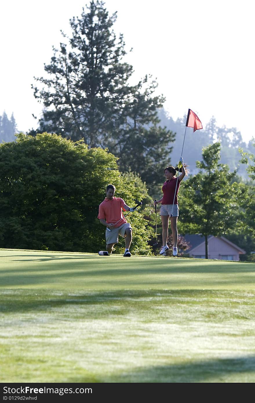 Man and Woman on Golf Course - Vertical