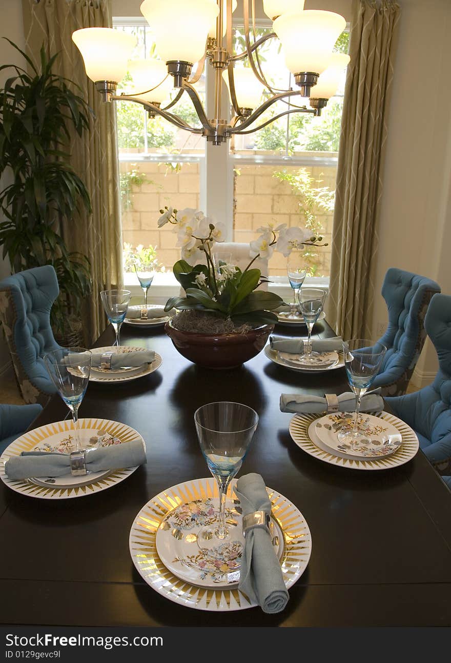 Dining room with modern tableware and decor. Dining room with modern tableware and decor.