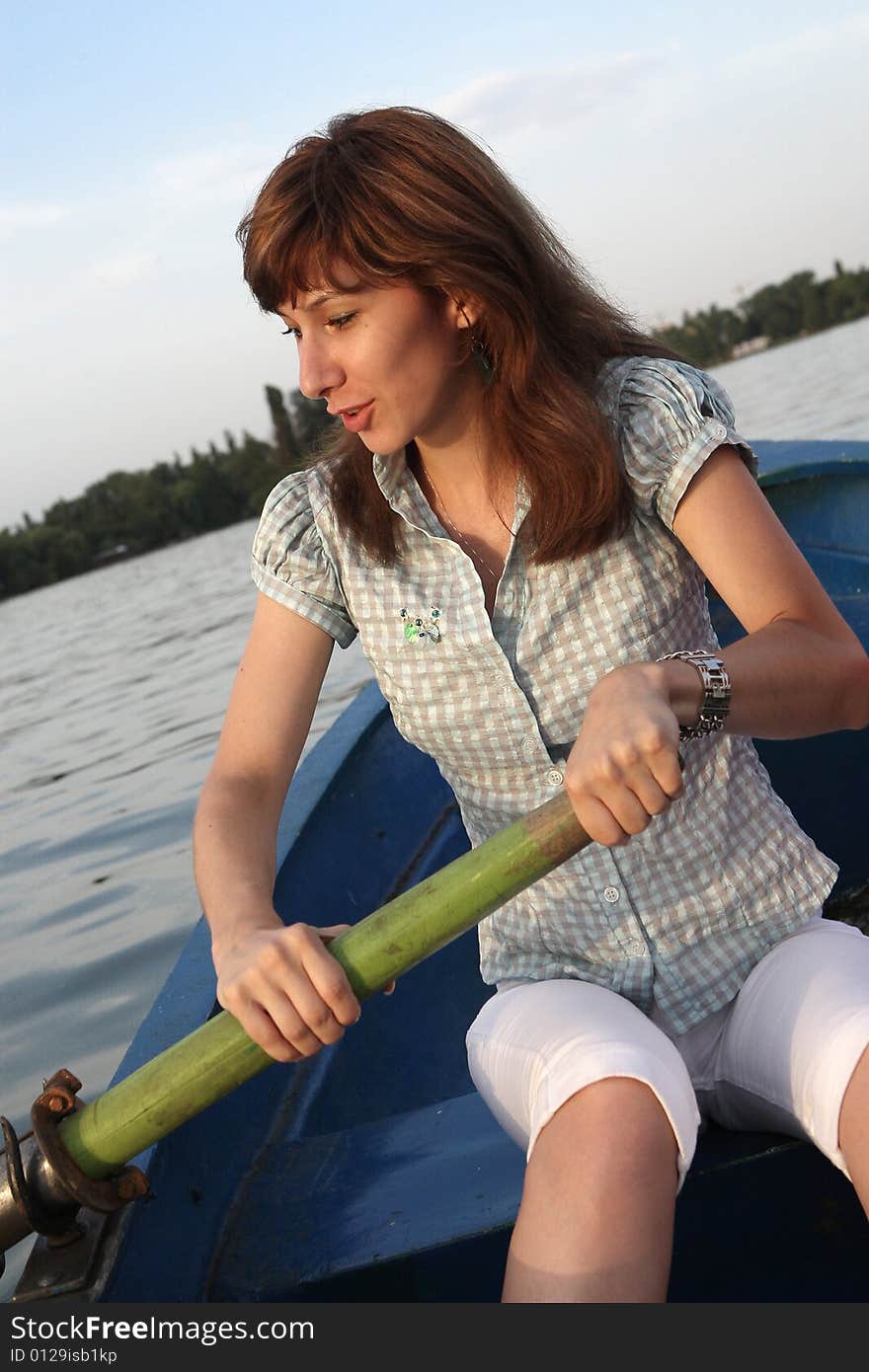 Girl rowing a boat