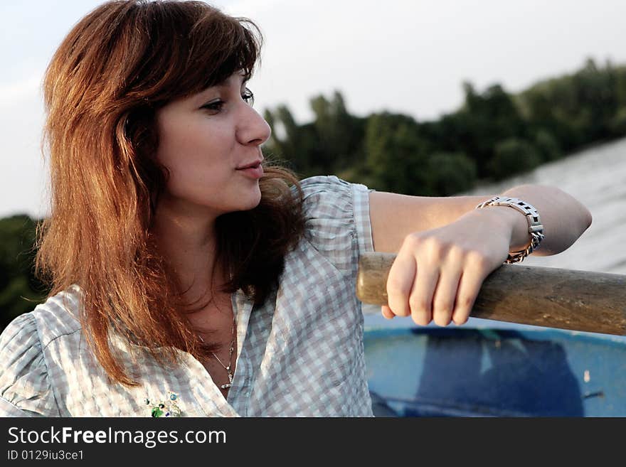 Girl rowing a boat