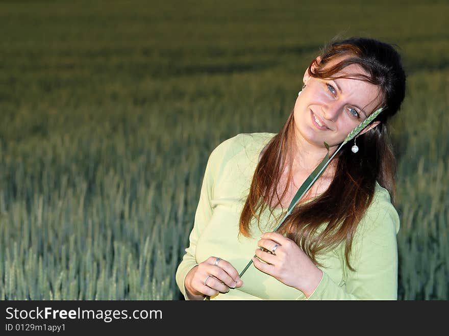 Attractive Female In Front Of Cereal Field