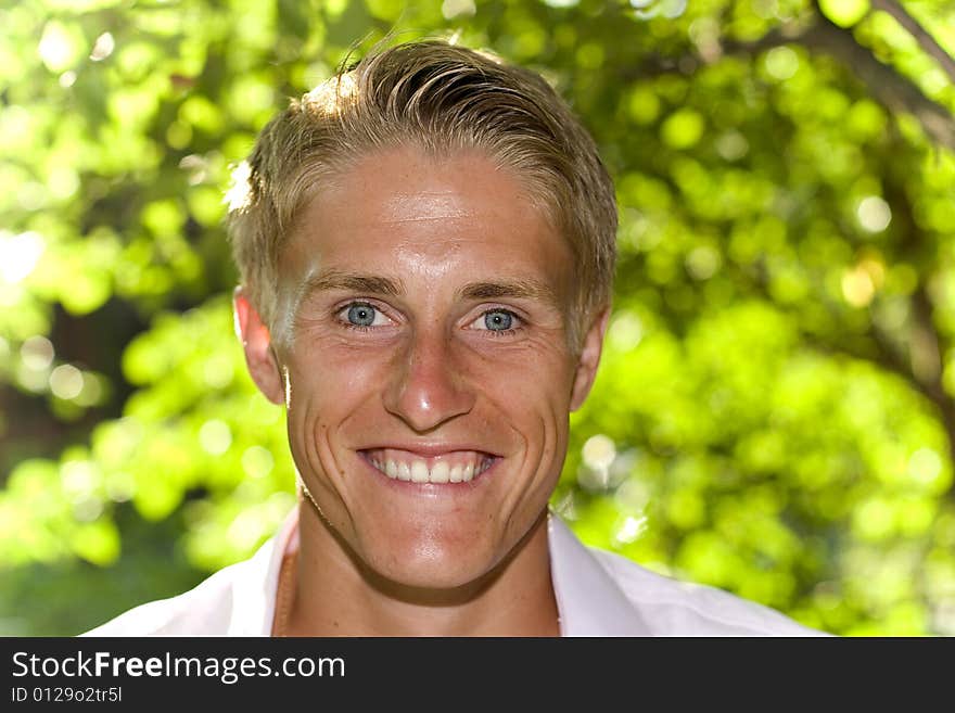 Happy young man in a park