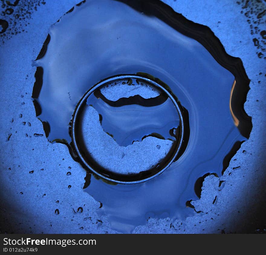 A detail of a plate with water and waterdrops. A detail of a plate with water and waterdrops