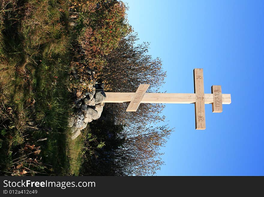 Grave with cross and stone