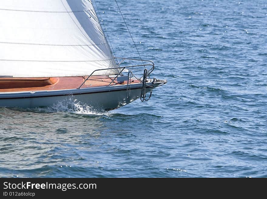 A sailing yacht on a lake.