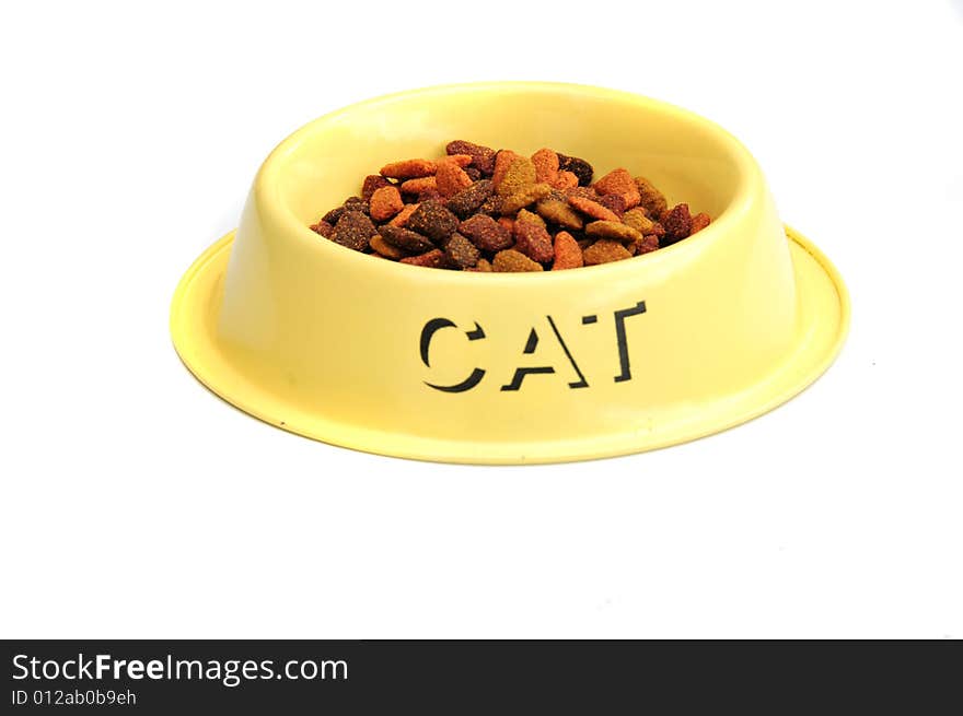 Shot of a cats feeding bowl with biscuits in. Shot of a cats feeding bowl with biscuits in