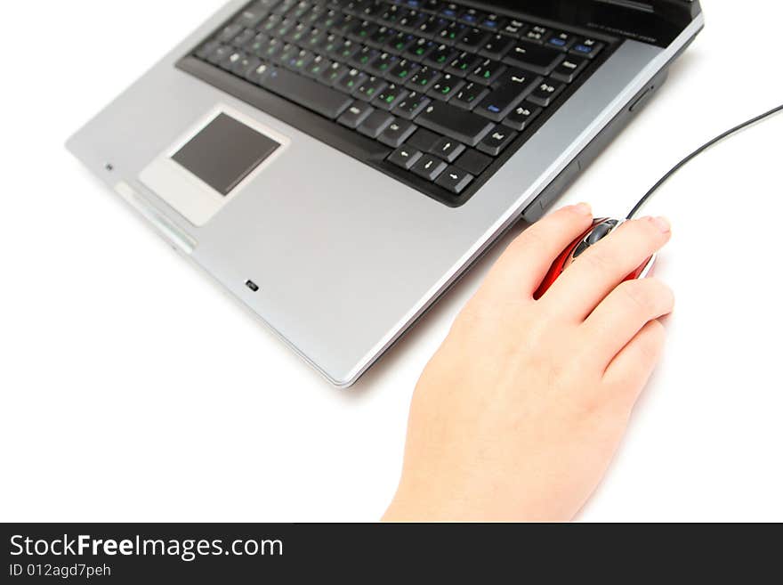 Computer and female hand holding red mouse