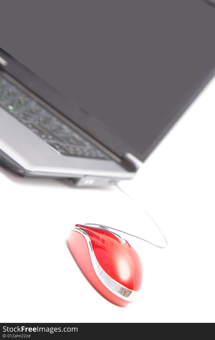 Computer and red mouse