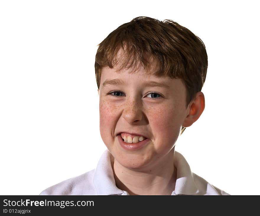 Portrait of a young boy smirking.