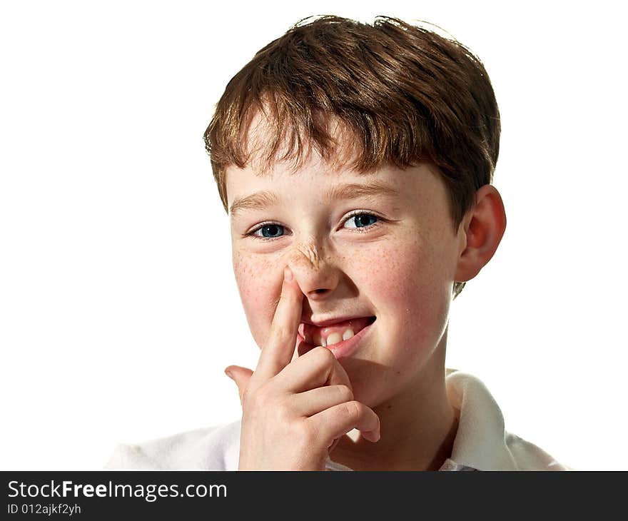 Young boy being playful and scratching nose. Young boy being playful and scratching nose.