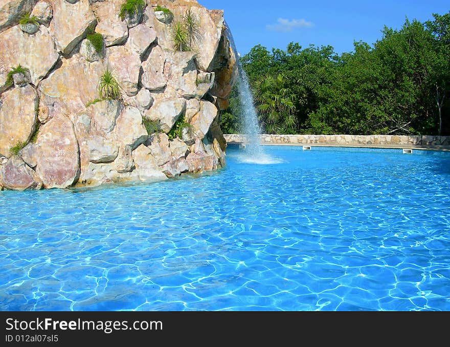 Carribean resort with pool waterfall