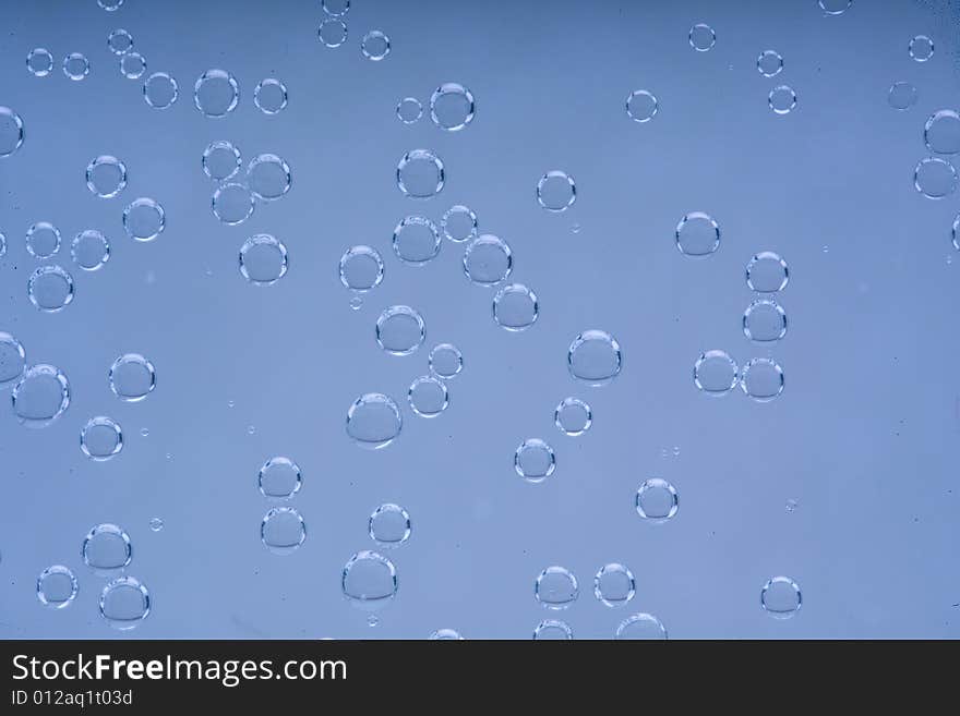 Drops of water on a blue background. Drops of water on a blue background