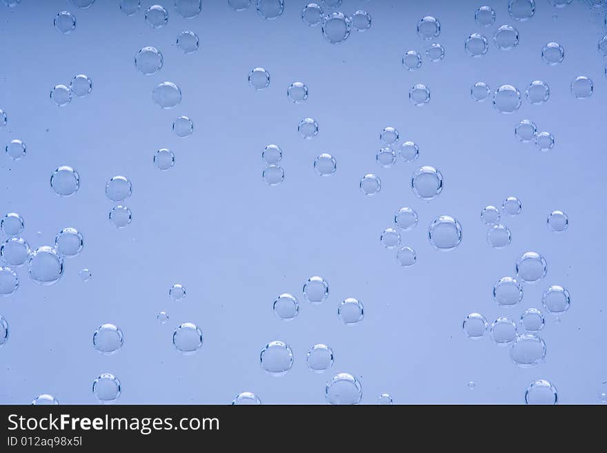 Drops of water on a blue background. Drops of water on a blue background