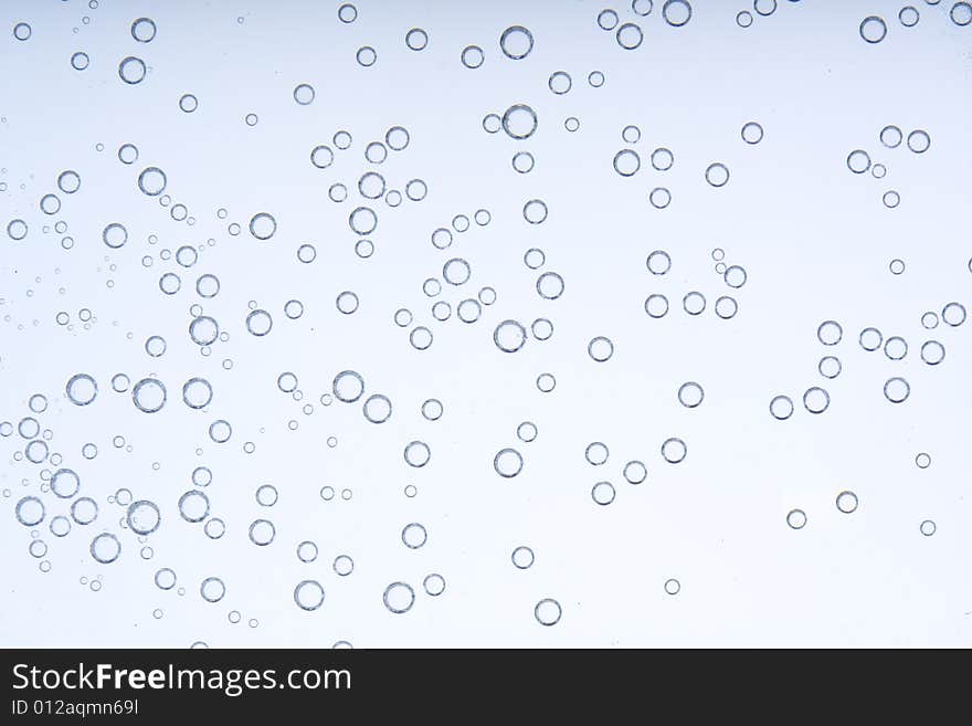 Drops of water on a blue background. Drops of water on a blue background