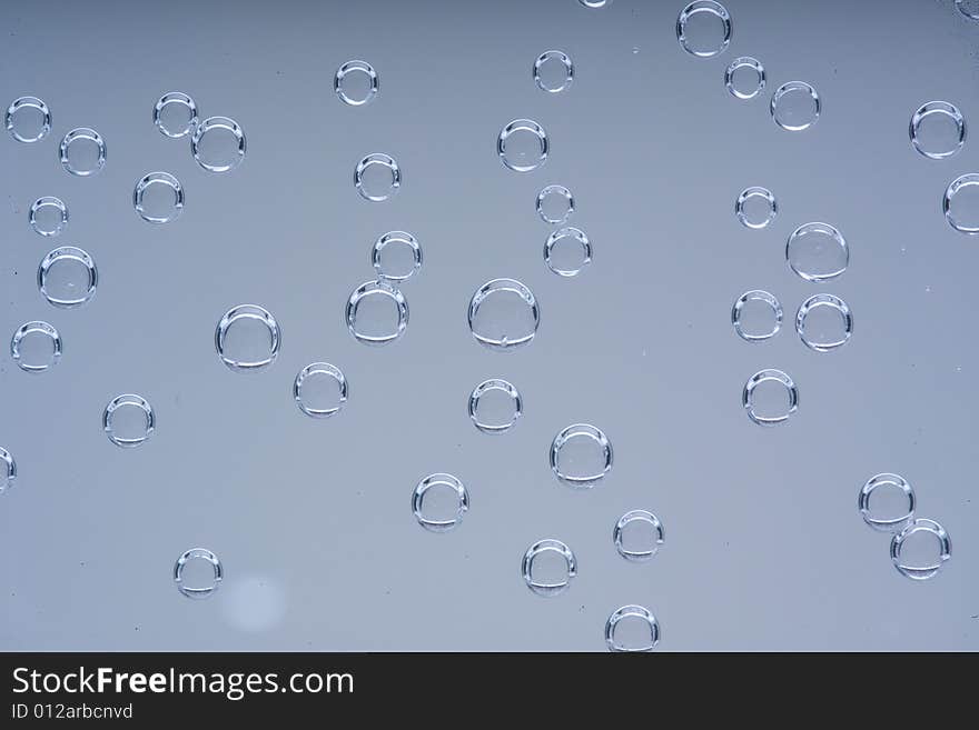 Drops of water on a blue background. Drops of water on a blue background